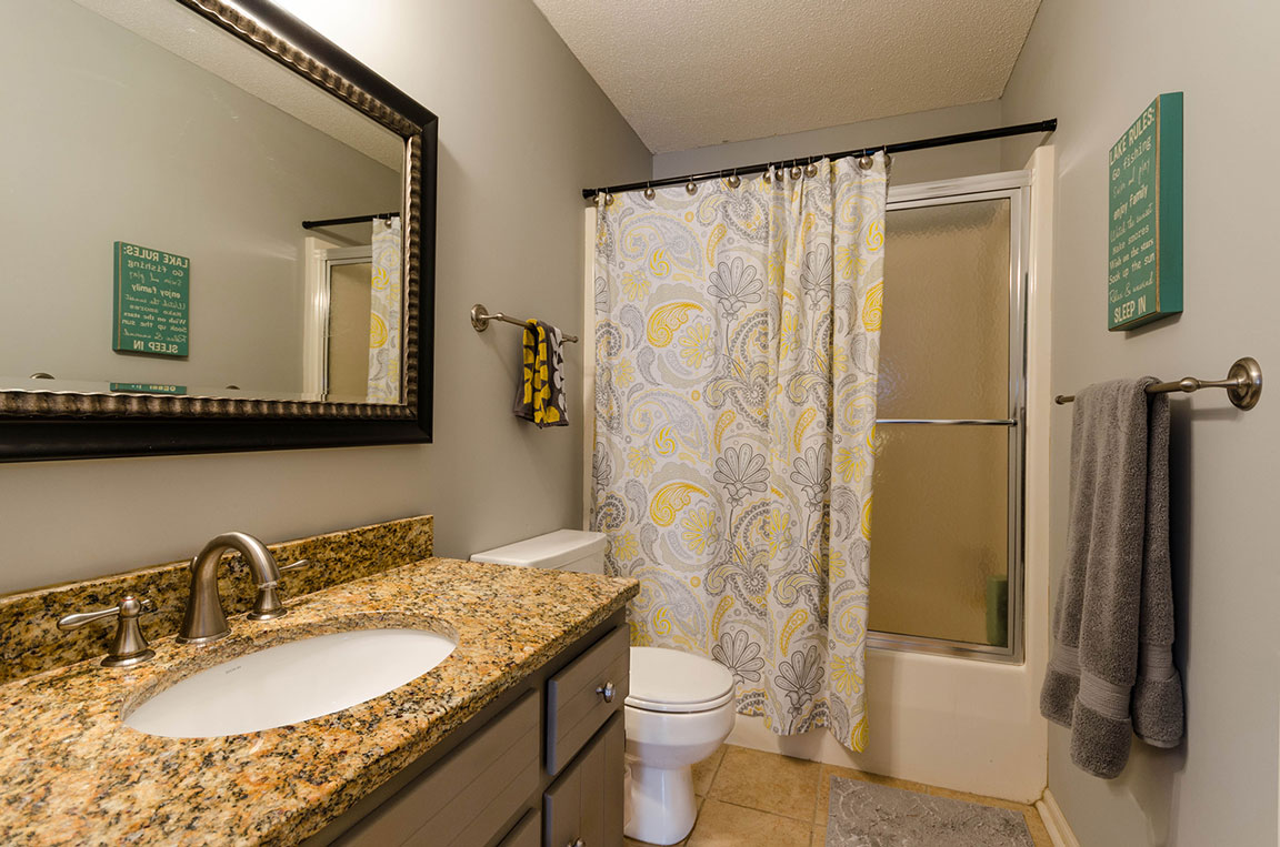 Real Estate Photography featuring a beautifully lit bathroom.